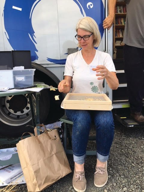 Karen Seabrook, Master Gardener Seed Library manager, volunteers at the pre-COVID library Bookmobile. Contactless pick-up of seed packets will be available at Bookmobile stops this spring.